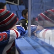 BUFFALO, NEW YORK - DECEMBER 31: A young fan looks on through the glass during Russia vs Sweden preliminary round action at the 2018 IIHF World Junior Championship. (Photo by Matt Zambonin/HHOF-IIHF Images)

